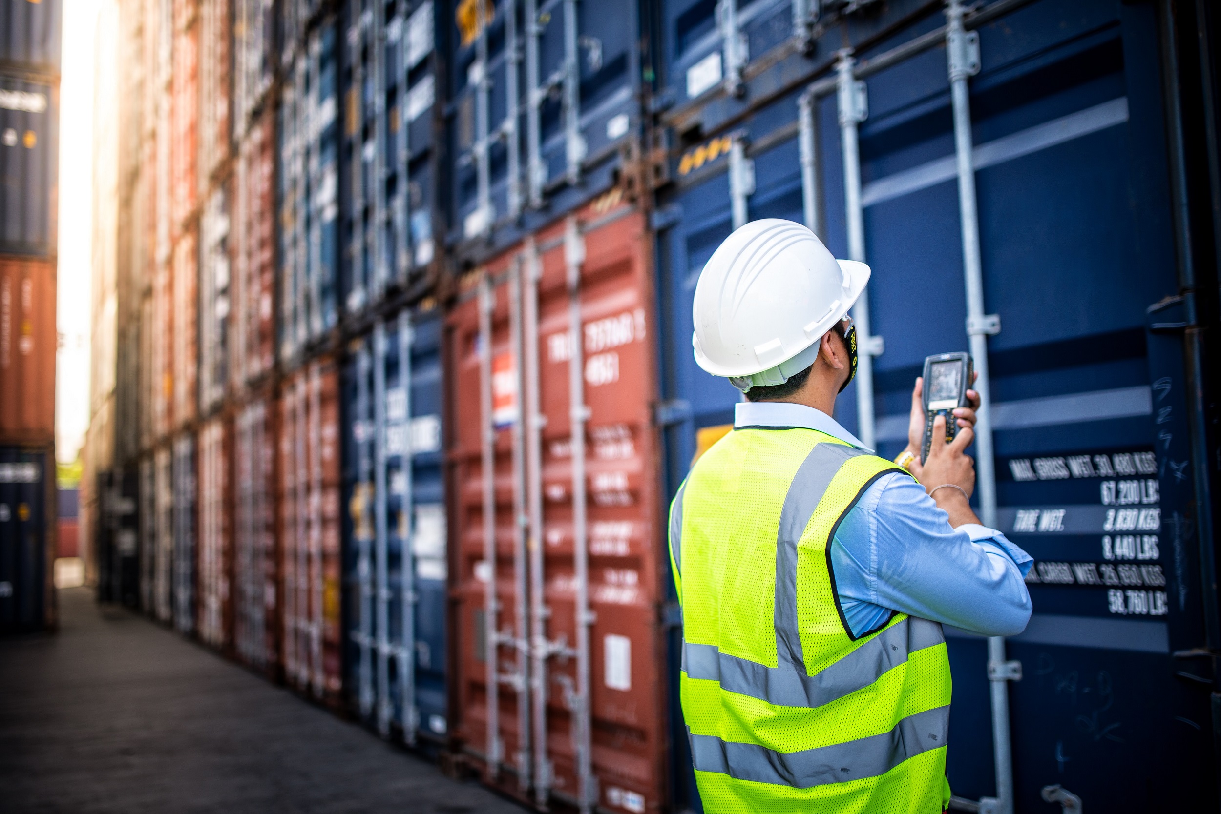 Foreman control loading Containers box to truck for Logistic Import Export Background, Business logistic concept, import and export concept